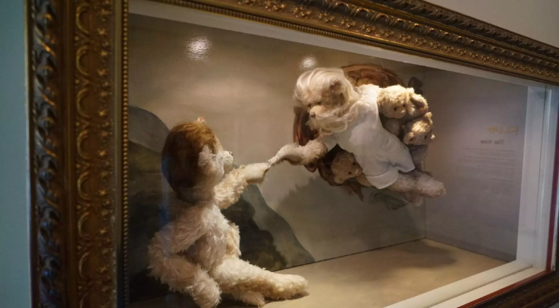 A teddy bear recreation of the masterpiece “The Creation of Adam” by Michelangelo.